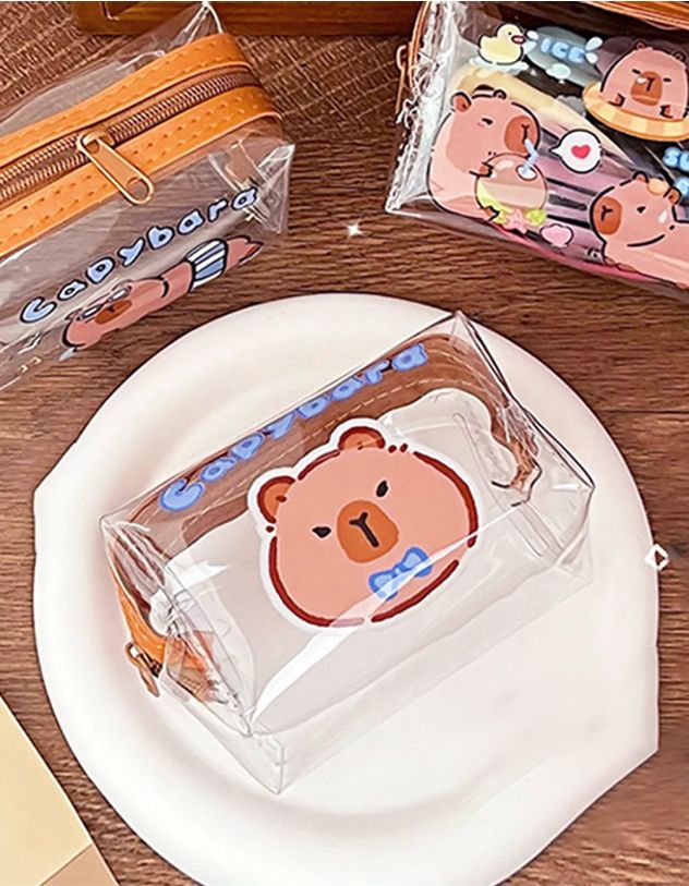 Монетниця прозора з брелоком та принтом капібари | 263998-18-XX - A-SHOP